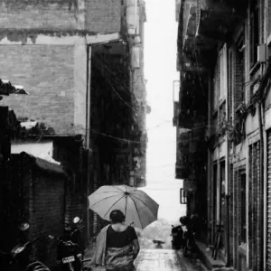 Woman walking in hard rain