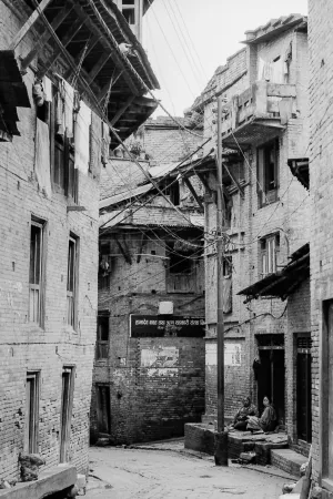 Figures in deserted alleyway