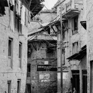 Figures in deserted alleyway