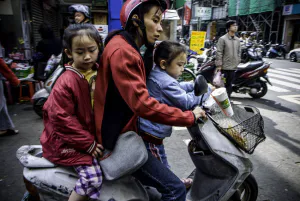 Parent and children on same motorbike