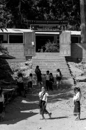School kids playing in front of gate