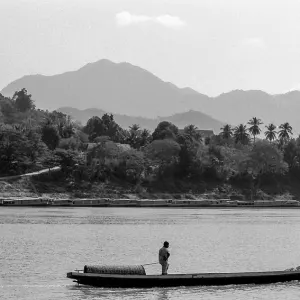 Man on wooden boat