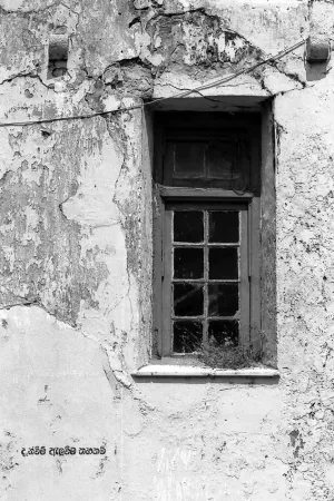 Window on dilapidated wall