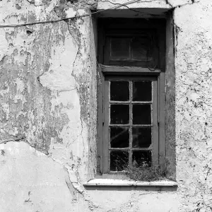 Window on dilapidated wall 