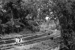 Three boys on railway track