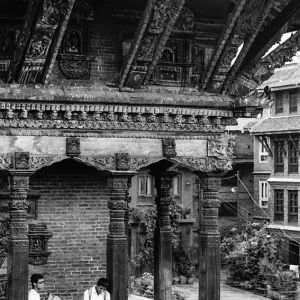 Boys under eaves of temple