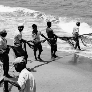 Fishermen dragging fishnet