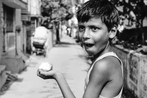 Boy holding mango
