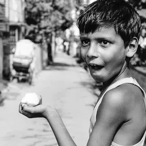 Boy holding mango