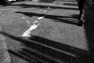 Shadows of a pedestrian on ground