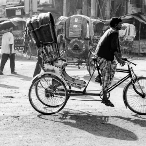 Cycle rickshaw running street