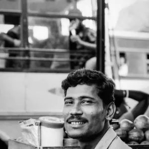Faint smile of street vendor