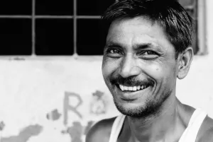 Man with stubble raising smile