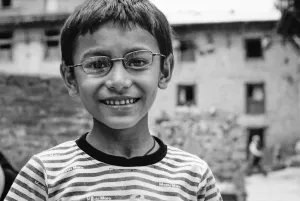 Boy wearing glasses and T-shirt