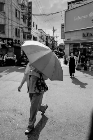 Chubby woman with umbrella