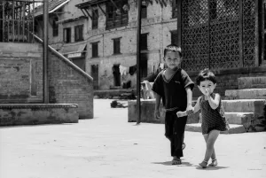 Siblings walking hand in hand