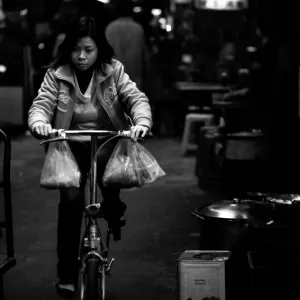 Woman pedaling bicycle