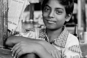 Boy looking after store