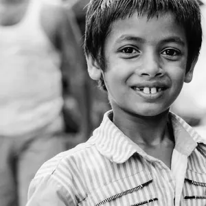 Boy smiling while showing front teeth