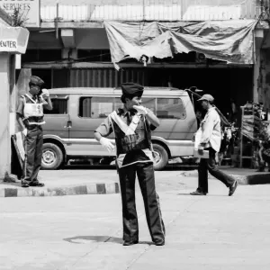 Woman directing vehicular traffic