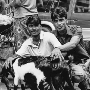 Goats and two men