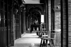 Man working in passage in Minchuan Old Street