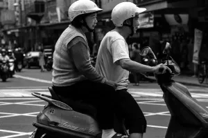 Old couple on same motorbike