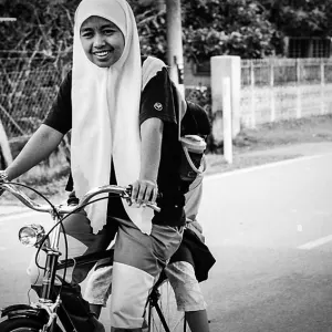 Girl pedaling bicycle