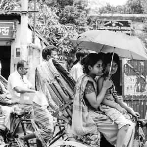 Parent and child on cycle rickshaw