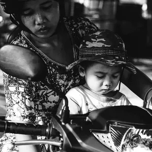 Mother and son on motorbike