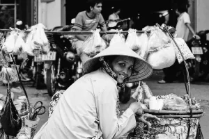 Female street vendor with a carrying pole