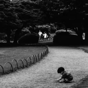 Boy playing in path in Shinjuku Gyoen