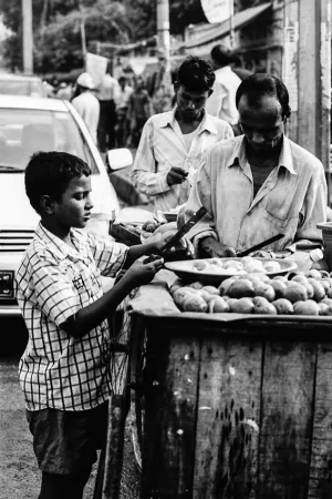 Men selling fruits by roadside