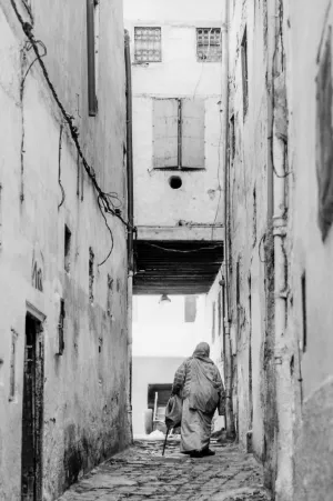 Older woman walking the lane