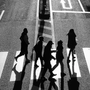 Silhouette crossing street