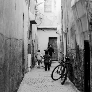Kids playing in lane in old quarter