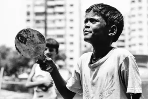 Boy holding racket
