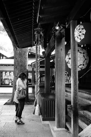 Woman joining hands in prayer in Todoroki Fudoson