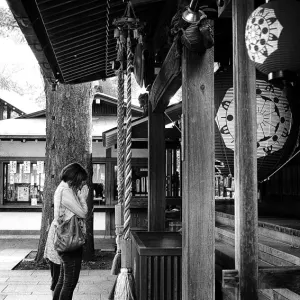 Woman joining hands in prayer in Todoroki Fudoson