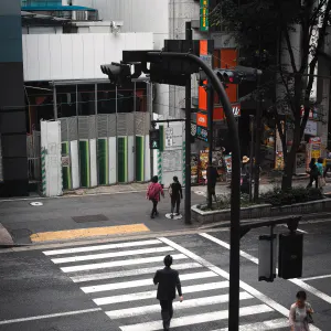 Businessman walking on striped pattern