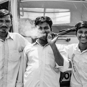 Three men and cigarette smoke