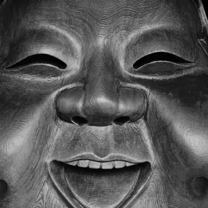 Wooden mask smiling