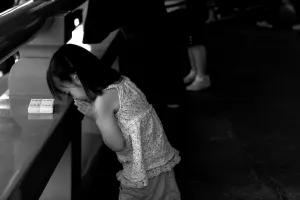 Girl praying in Senso-Ji