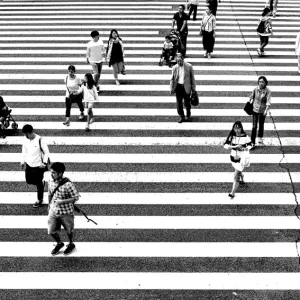 Pedestrians crossing wide street