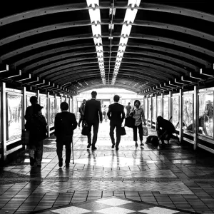 Pedestrians walking under railway underpass