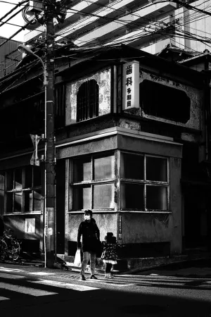 parent and child in front of old building
