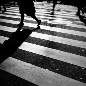 Silhouettes on pedestrian crossing