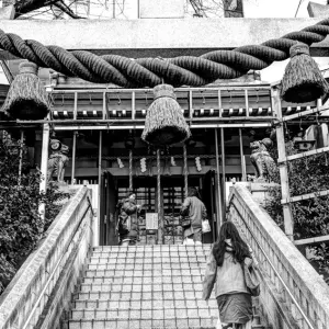 Woman entering Shinto shrine