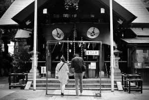 Young couple in Tsukiji Namiyoke Jinja
