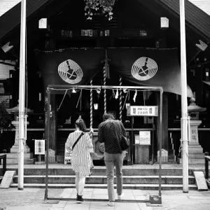 Young couple in Tsukiji Namiyoke Jinja